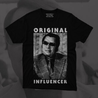 Black Hate Couture t-shirt featuring a stark portrait of cult leader Jim Jones, captioned with the words “Original Influencer” in bold, cynical lettering.